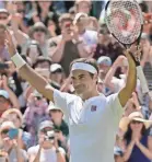  ?? TIM IRELAND/AP ?? Roger Federer, wearing Uniqlo apparel, acknowledg­es cheers from the crowd Monday after defeating Dusan Lajovic at Wimbledon.