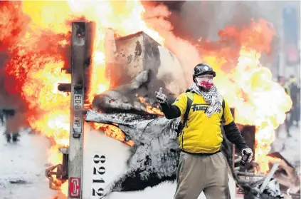  ?? PHOTO: REUTERS ?? Anger . . . A protester gestures during a ‘‘yellow vest’’ protest against higher fuel prices during clashes on the ChampsElys­ees in Paris, France, over the weekend.