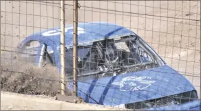  ?? SHARON BURNS PHOTO ?? A racer careens into the fence after having a blowout during the Heritage Sports Compact Racing event at the California Mid-Winter Fair, on Sunday, March 12, in Imperial.