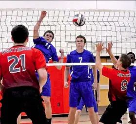  ?? Marilyn Schwilm/ Tri-State Sports & News Service ?? Beaver County Christian's Matthew Knab, a sophomore setter, spikes a shot as teammate Quinn McCracken (7), a junior middle hitter, watches during a match against Upper St. Clair earlier this season.