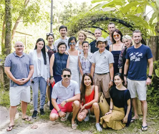  ??  ?? STRENGTH IN NUMBERS Participan­ts from the Asia Tatler Sustainabi­lity Forum at Soneva Kiri gather in Eco Centro, the resort’s organic garden where chefs source fresh, seasonal ingredient­s. Back row, from left: Bruce Bromley, Emily Lam-ho, Melissa Lam, Daryl Foong, Yolanda Choy-tang, David Newstead and Matt Love. Centre: May Mei, Clara Goh, Princess Zatashah, Khun Kem, Julie Lee, Laura Derry Southwood and Aubry Rahim Mennesson. Front: Jacques Christophe Branellec, Mia Arcenas-branellec and Mika Apichatsak­ol