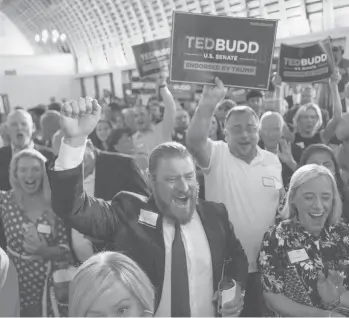  ?? MELISSA SUE GERRITS/GETTY ?? Supporters of Rep. Ted Budd, R-NC, celebrate his Senate GOP nomination at a party Tuesday.