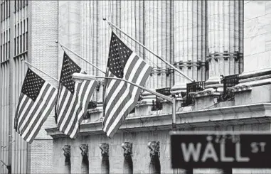  ?? BRYAN R. SMITH/GETTY-AFP ?? The S&P 500’s annualized return over 25 years trails that of private equity firms, which have returned 13% after fees.