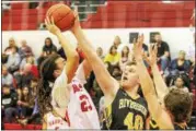  ?? BARRY BOOHER — THE NEWS-HERALD ?? Riverside’s Chad Kalb rejects a shot from Harvey’s Bishop Thomas on Feb. 24.