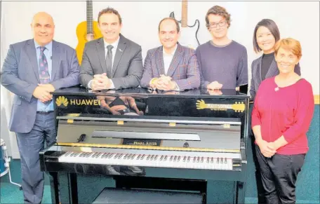  ??  ?? Receiving their new piano are (from left) Tamatea High School principal Robin Fabish, MP for Napier Stuart Nash, Huawei NZ deputy managing director Andrew Bowater, Raukatauri Music Therapy Centre music therapist Will Darbyshire, Huawei stakeholde­r relations and event manager Vera Wei and founder of Raukatauri Music Therapy Centre, Hinewehi Mohi.