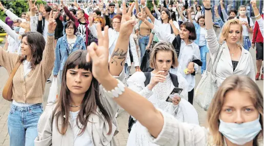 ?? PHOTO: REUTERS ?? Stand and be counted: Women take part in a protest against police violence in Minsk yesterday.