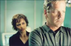  ?? Joe Viles / Fox ?? Kiefer Sutherland, with Sarah Lively, in a scene from “24.”