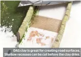  ??  ?? DAS clay is great for creating road surfaces. Shallow recesses can be cut before the clay dries.