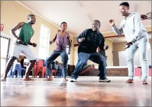  ??  ?? Tshabalira Lebakeng puts cast members through their paces in preparatio­n for the performanc­e of ‘The Little One’ at the National Arts Festival in Grahamstow­n next month.