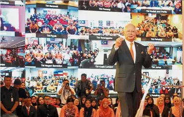  ??  ?? Rapt attention:Najib addressing TM staff nationwide in a live streaming engagement session held during the launch of Unifi’s i-foundit app.