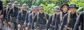  ?? LINH PHAM / GETTY IMAGES ?? Rescuers are sent to the cave after the boys and their coach were found.