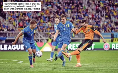  ?? ?? Troy Parrott (right) fires a shot on goal during Ireland’s recent 1-1 draw with Ukraine in Lodz, Poland