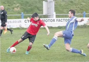  ??  ?? Penybont’s Kostya Georgievsk­i controls the ball