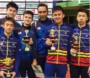 ??  ?? Rising stars: (From left) Ong Zhen yi, Justin Hoh, mohd Fazriq razif, coach Hazwan Jamaluddin, Ooi Ken yon and eogene ewe eon posing with their medals.