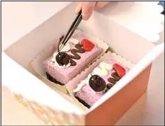  ?? HYOUNG CHANG — THE DENVER POST ?? Dana Shin finishes a walnut brownie with fresh cherry moose cakes on Feb. 10.