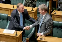  ?? PHOTO: MAARTEN HOLL/STUFF ?? John Key shakes hands with Bill English following his valedictor­y speech.