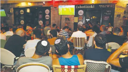  ?? (Marc Israel Sellem/The Jerusalem Post) ?? FOOTBALL FANS gather in Jerusalem to watch England play Italy in the UEFA final.