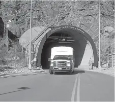  ?? AP Photo/Dan Elliott ?? ■ In this Thursday photo, a crew bus leaves the the Cheyenne Mountain Air Force Station complex outside Colorado Springs, Colo. The U.S. military blasted tunnels out of the mountain in the 1960s for a command center for the North American Aerospace...