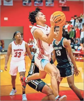  ?? Charlie Qualls, Warriors In Motion Photograph­y ?? LFO guard Jayden Dover drives to the hoop during the Warriors’ opening-round playoff game against Douglass of Atlanta last week.