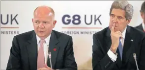  ?? Picture: REUTERS ?? WAITING GAME: British Foreign Secretary William Hague, left, and US Secretary of State John Kerry attend the first session of the Group of Eight foreign ministers’ meeting at Lancaster House in London yesterday.