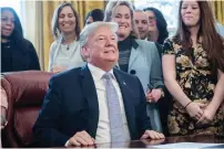  ?? AFP ?? US President Donald Trump looks on before signing the Allow States and Victims to Fight Online Sex Traffickin­g Act of 2017 in the Oval Office at the White House in Washington. —