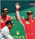  ?? FOTO:
LEHTIKUVA/ANDREJ ISAKOVIC ?? Kimi Räikkönen (t.h.), Lewis Hamilton och Sebastian Vettel ställde sig på prispallen i Silverston­e.
