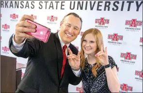  ?? Arkansas Democrat-Gazette/BENJAMIN KRAIN ?? Kelly Damphousse, favored to become the new chancellor of Arkansas State University, poses with ASU student body President Haley Stotts after he was introduced Wednesday in Little Rock.