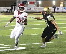  ?? The Sentinel-Record/Richard Rasmussen ?? ■ Arkansas High’s Torie Blair (3) runs the ball as Hot Springs’ David Carter (88) defends during action Friday at Hot Springs.