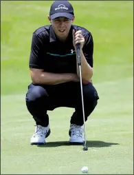  ?? AP/MARK HUMPHREY ?? Matthew Fitzpatric­k views his putt on the seventh green during the second round of the St. Jude Invitation­al on Friday in Memphis. He shot a 6-under 64 to take a two-stroke lead.