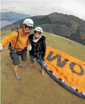  ??  ?? All set for take-off – Manson and GForce pilot Dan Roborgh before their flight over Queenstown.