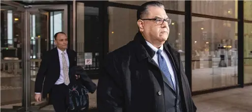  ?? TYLER LARIVIERE/SUN-TIMES FILE ?? Former state Sen. Martin Sandoval walks out of the Dirksen Federal Building in January 2020 after his arraignmen­t hearing. Feds have charged Rudy Acosta Sr. with concealing informatio­n from the FBI about cash payments made to a state senator, who a source confirmed was Sandoval.