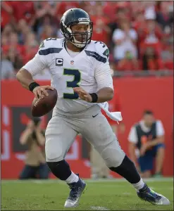  ?? AP PHOTO ?? Seattle Seahawks quarterbac­k Russell Wilson looks to pass against the Tampa Bay Buccaneers.