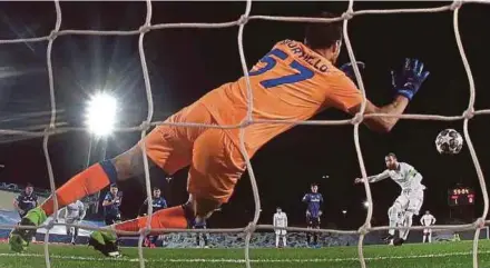  ?? EPA PIC ?? Real Madrid’s Sergio Ramos (right) scores from a penalty kick against Atalanta in Tuesday’s Champions League last 16 second leg match at Alfredo Di Stefano Stadium.