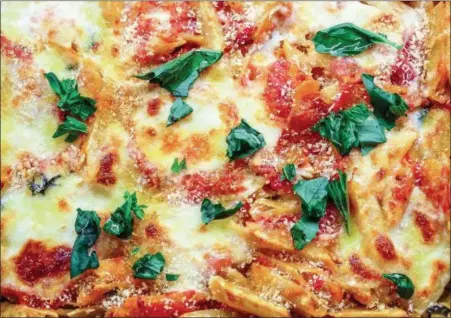  ?? PHOTO BY ALLISON AREVALO ?? Above, Baked Trenne with Fresh Mozzarella and Basil is one of the 24 dinners Allison Arevalo (shown below) has hosted at her Rockridge, Calif., home as part of her Pasta Friday movement to unite friends at the end of the week.