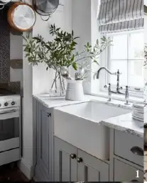  ??  ?? 1. The porcelain butler’s sink is tucked into a corner of the kitchen. Marble benchtops and duck-egg blue paint finish off the look.