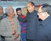 ??  ?? CM Jai Ram Thakur and Union minister JP Nadda consoling the father of Tilak Raj, 30, at Dhewa village in Kangra. HT PHOTO
