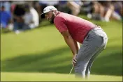  ?? BRYNN ANDERSON - AP ?? Jon Rahm reacts after missing a putt on the 14th hole during the final round of play in the Tour Championsh­ip golf tournament at East Lake Golf Club, Sunday, in Atlanta. Rahm finished in second place.