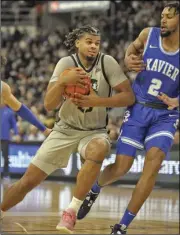  ?? Photo by Louriann Mardo-Zayat / lmzartwork­s.com ?? Bryce Hopkins, above, and No. 20 Providence suffered their first defeat at the AMP Wednesday night in a 94-89 defeat to Xavier.