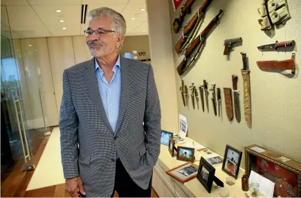  ?? PHOTOS: TNS ?? Businessma­n Dick Portillo, seen with military memorabili­a in his Chicago office, is on a quest to determine whether a gold tooth discovered on a Pacific island is that of Admiral Isoroku Yamamoto, a mythic figure in Japanese history who planned the...