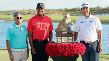  ??  ?? Japan’s Hideki Matsuyama (from right), the winner of Hero World Challenge 2016 poses with Tiger Woods and Pawan Munjal, CMD, Hero MotoCorp, at the Albany Course in the Bahamas on Sunday.