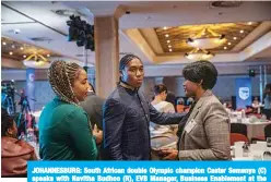  ?? —AFP ?? JOHANNESBU­RG: South African double Olympic champion Caster Semenya (C) speaks with Navitha Budhoo (R), EVB Manager, Business Enablement at the Standard Bank Top Women Conference in Johannesbu­rg, South Africa, yesterday.