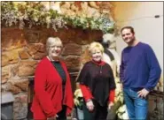  ?? REBECCA BLANCHARD — DIGITAL FIRST MEDIA ?? Woman’s Club of Exeter President Lois Ensslen, Fran Vogt of the board of directors, and homeowner Brian Rundle in front of the stone fireplace.