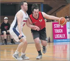  ??  ?? HOT CONTEST: Ararat Redback Josh Fiegert drives around Hornet Matt Lovel during Sunday’s clash. Picture: PAUL CARACHER