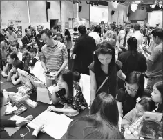  ??  ?? Parents talking to school representa­tives at the Private & Internatio­nal School Fair in Johor.