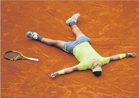  ?? AFP ?? Rafael Nadal celebrates after beating Dominic Thiem in the French Open final.