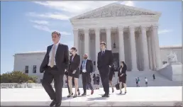  ?? Associated Press ?? People leave the Supreme Court in Washington on Monday as justices issued their final rulings for the term. The high court is letting a limited version of the Trump administra­tion ban on travel from six mostly Muslim countries to take effect.