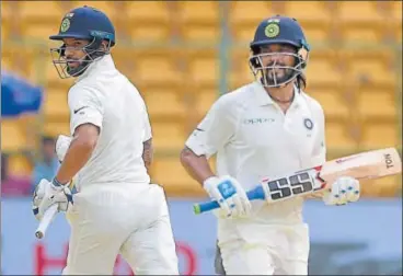  ?? PTI ?? Shikhar Dhawan (left) and Murali Vijay added 168 runs for the first wicket on Day One of the historic Test.