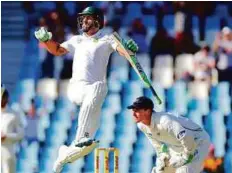  ?? Reuters ?? South Africa’s Faf du Plessis jumps to celebrate his century. Apart from a burst of scoring immediatel­y after lunch, it was slow going for Du Plessis, who had faced 205 balls by tea.