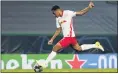  ?? MIGUEL A. LOPES — POOL PHOTO VIA AP ?? Leipzig’s Tyler Adams scores his side’s second goal during the Champions League quarterfin­al match against Atletico Madrid at Lisbon, Portugal on Thursday.