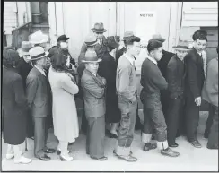  ?? Dorothea Lange / National Archives and Records Administra­tion 1942 ?? Japanese Americans in San Francisco, among those directly affected by the Presidio general’s 1942 exclusion order, wait in line to register for evacuation to an internment camp. The photo is part of the “Exclusion” exhibition on display at the Presidio...